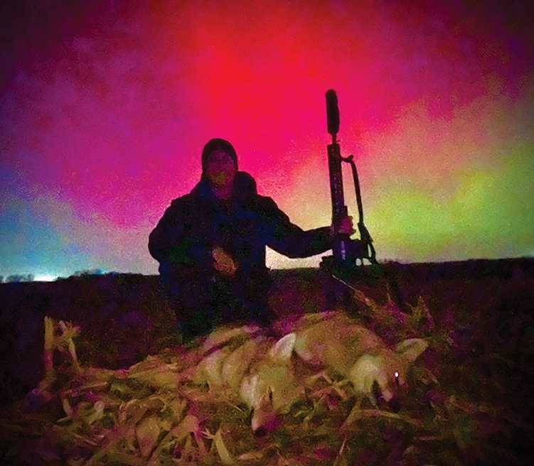 The first three sets on November 11, 2025, resulted in four coyotes. The author and two coyotes from the last stand pose for a once-in-a-lifetime photo opportunity with Mother Nature.